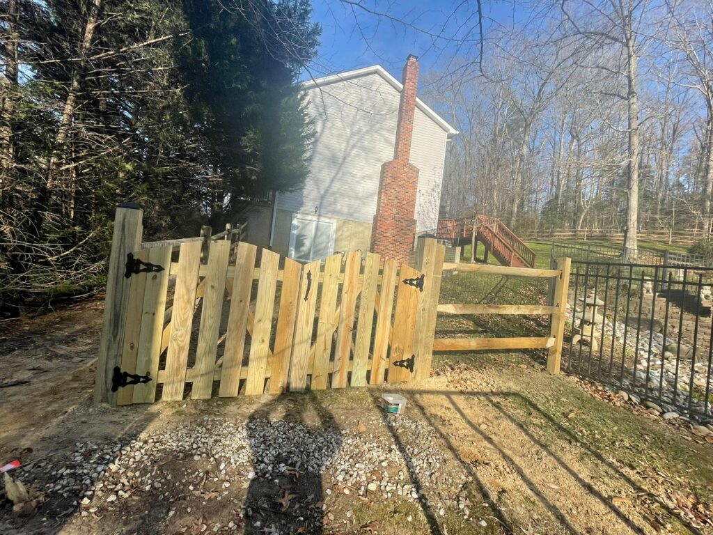 Wood fence and gate with a horizontal rail section