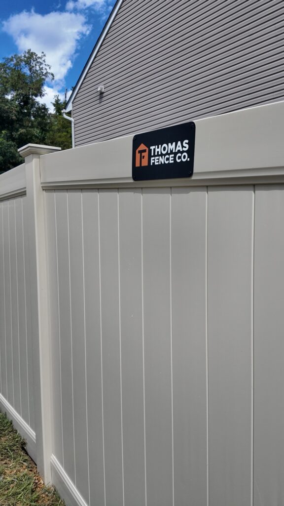 Tan vinyl privacy fence beside a home in Myrtle Beach, SC