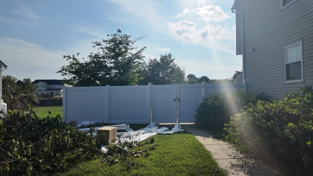 White vinyl fence gate in a backyard in Raleigh, NC